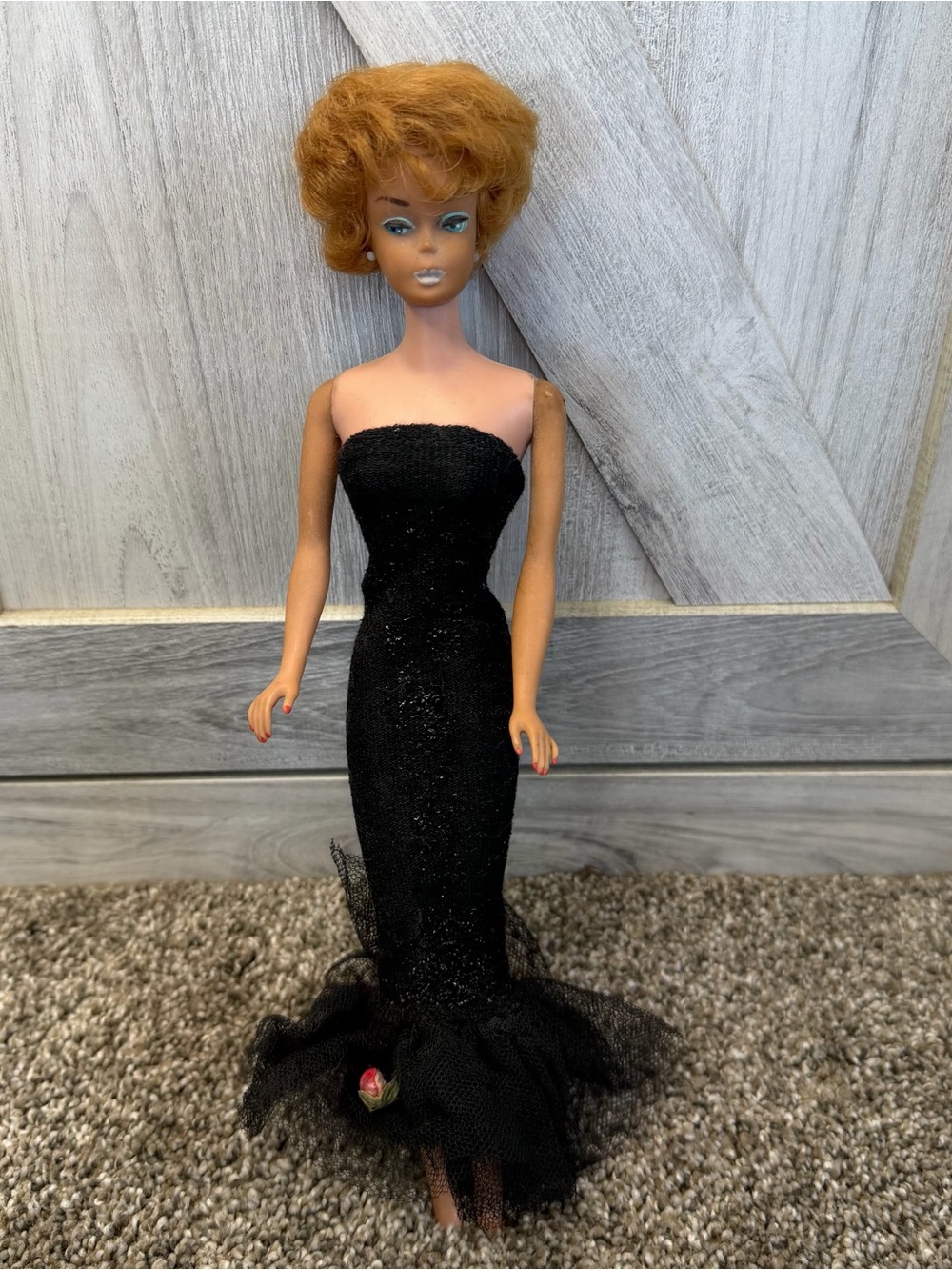 Vintage Mattel Barbie doll wearing the iconic "Solo in the Spotlight" 1960